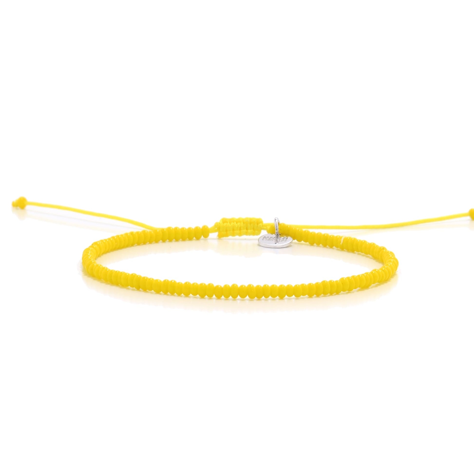 Handmade yellow bead bracelet with adjustable cord and silver charm