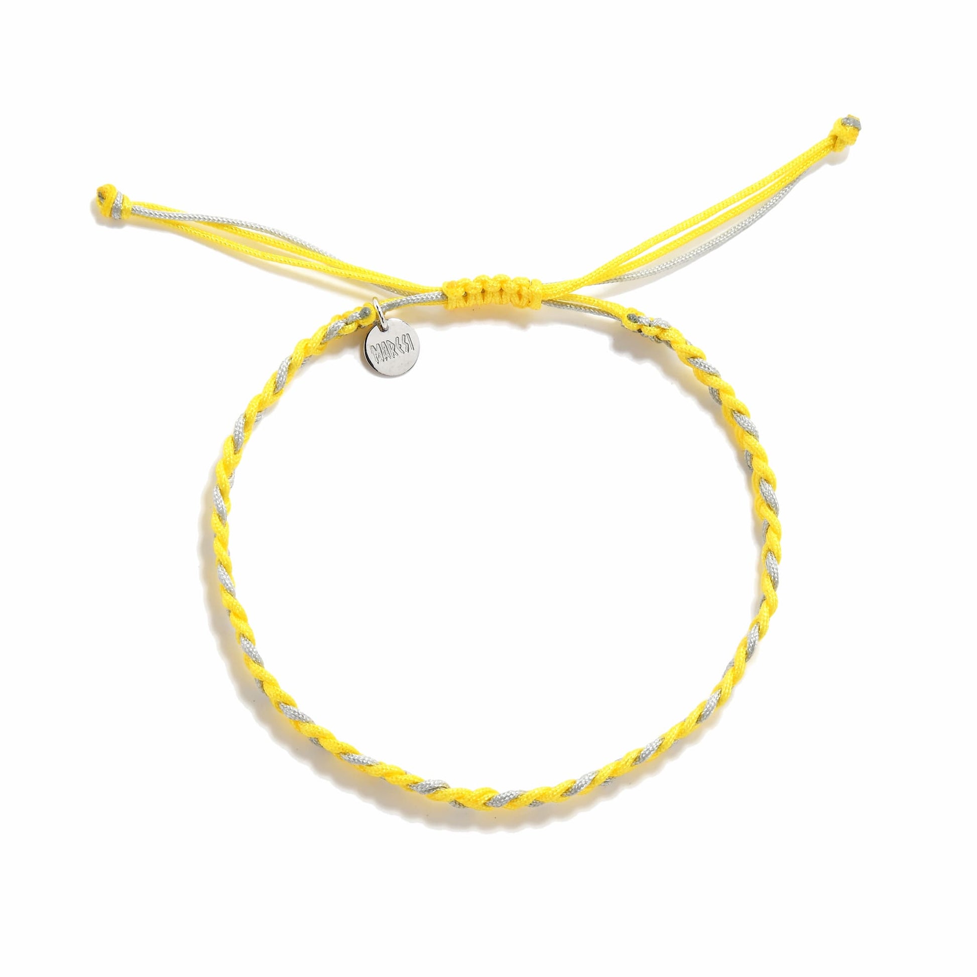 Flat lay of adjustable friendship bracelet made with yellow and gray thread and charm