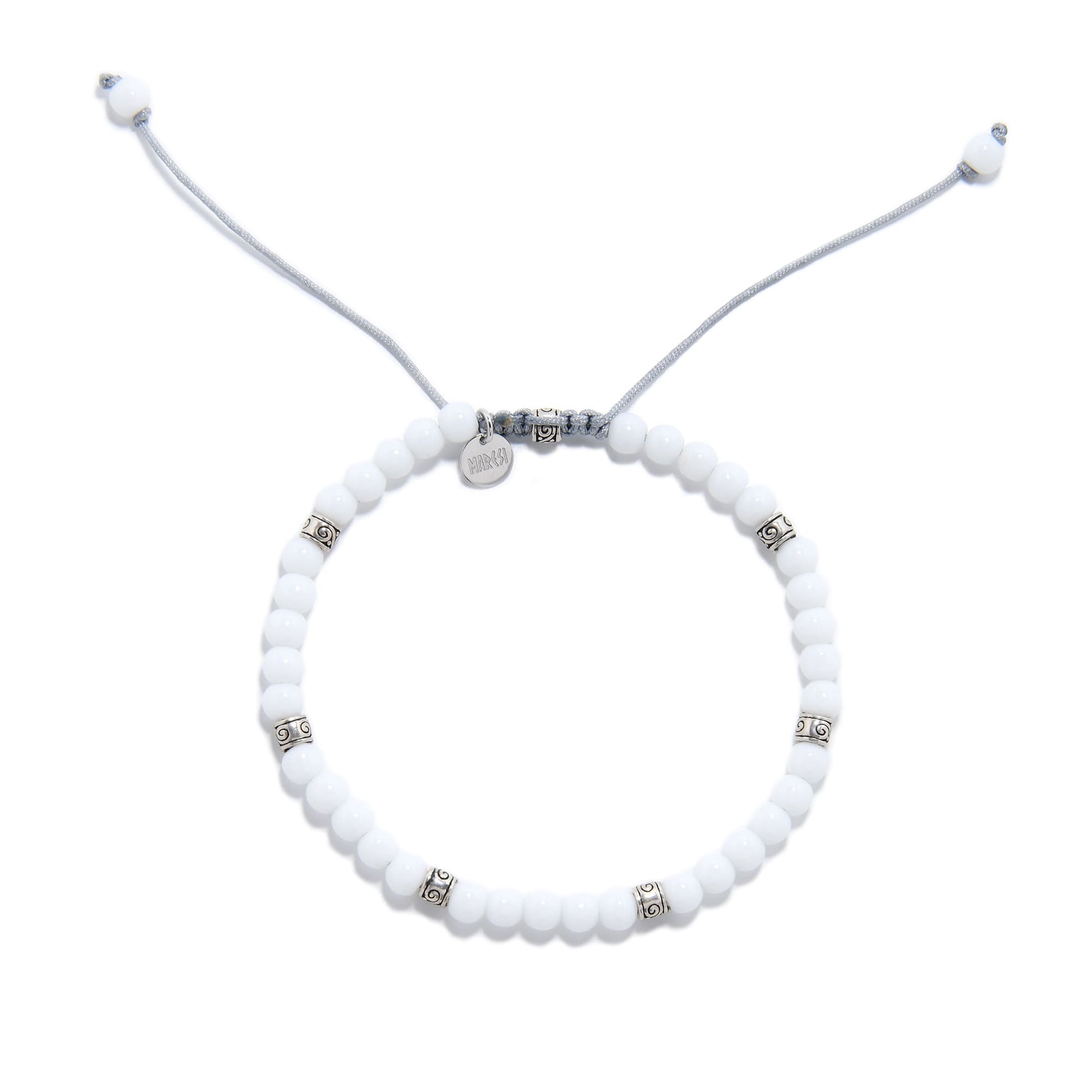 Adjustable white jade stone bead bracelet with silver decorative spacers.
