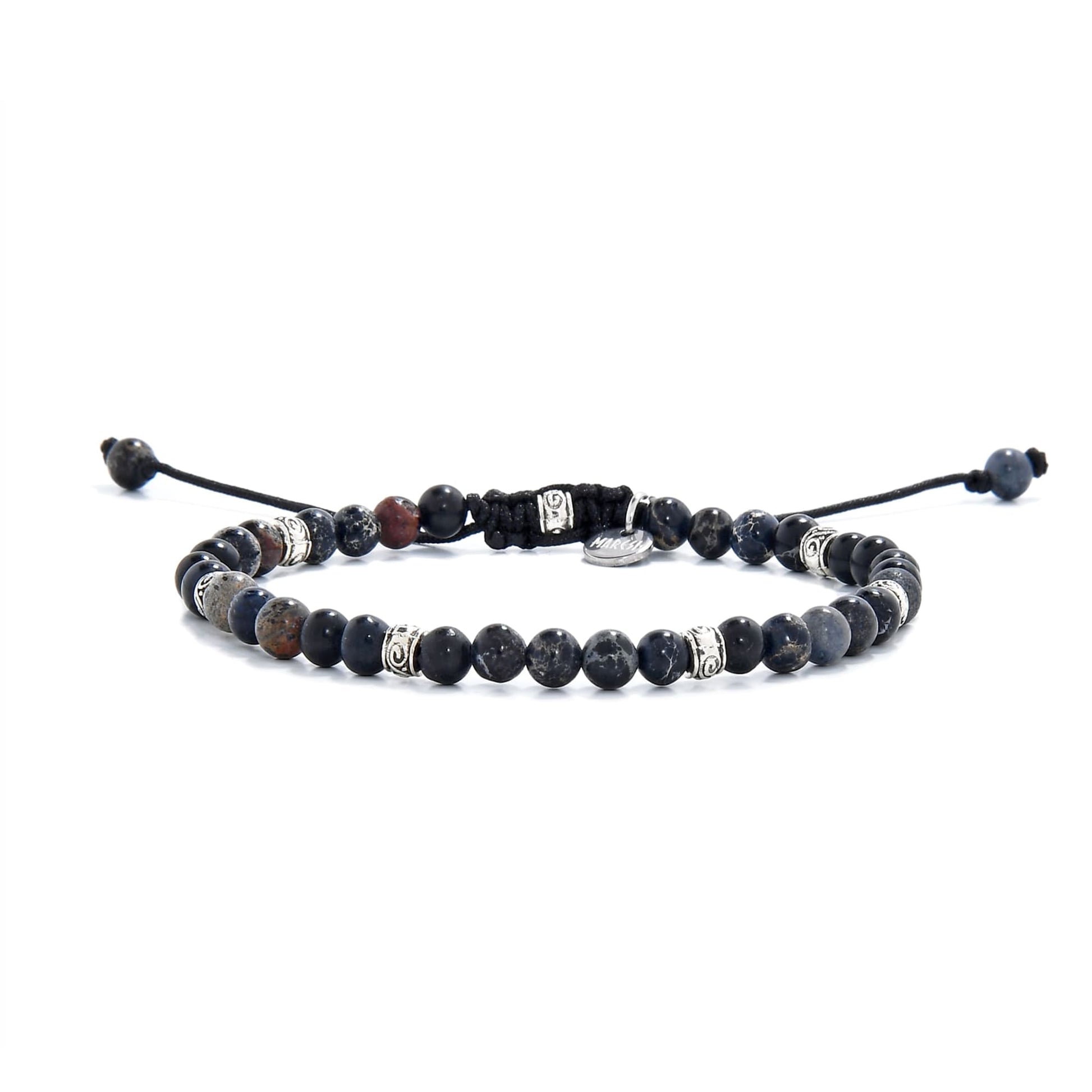 Full view of bracelet with polished black jasper beads and metal decorative accents.
