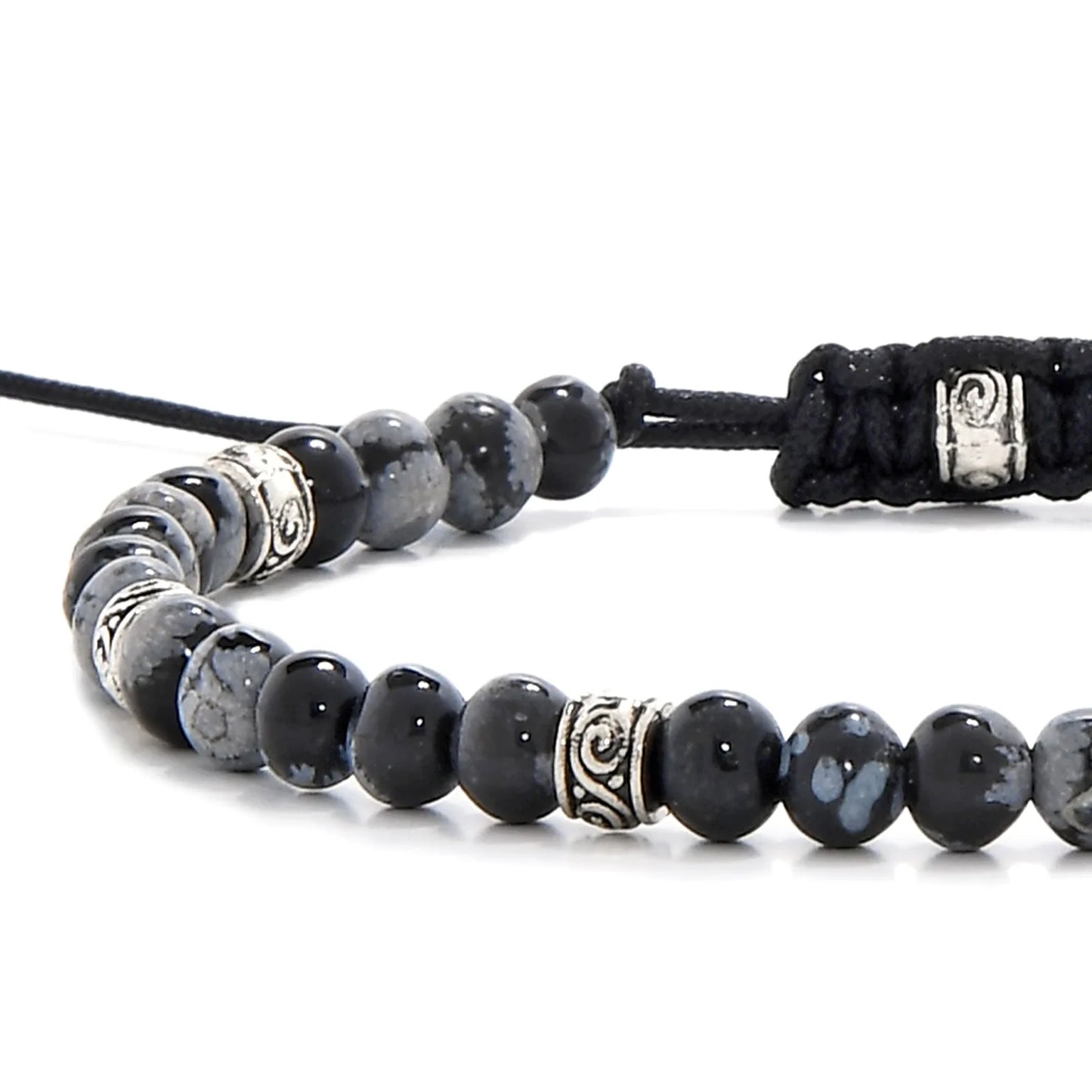 Close-up of black stone bracelet with silver accent beads and polished black jasper stones.