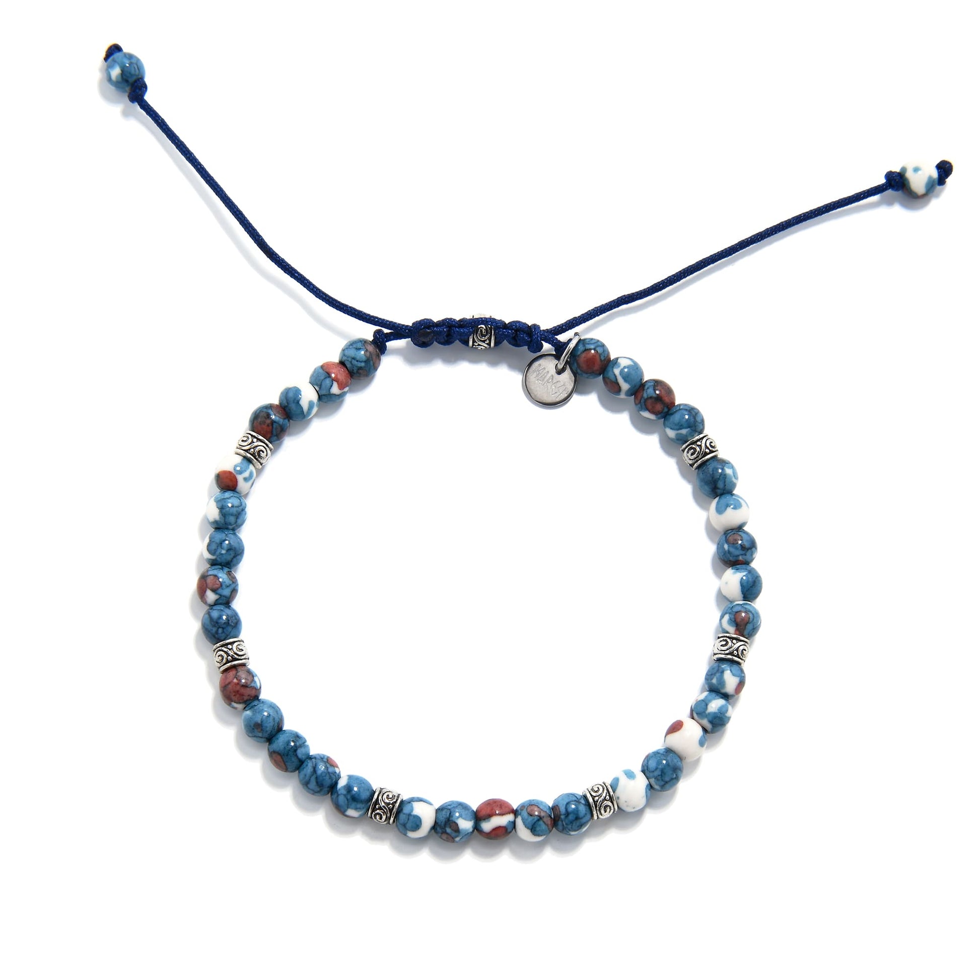 Top view of blue flower jasper bracelet showing round beads in blue, red, and white, with detailed silver accents and adjustable navy cord.