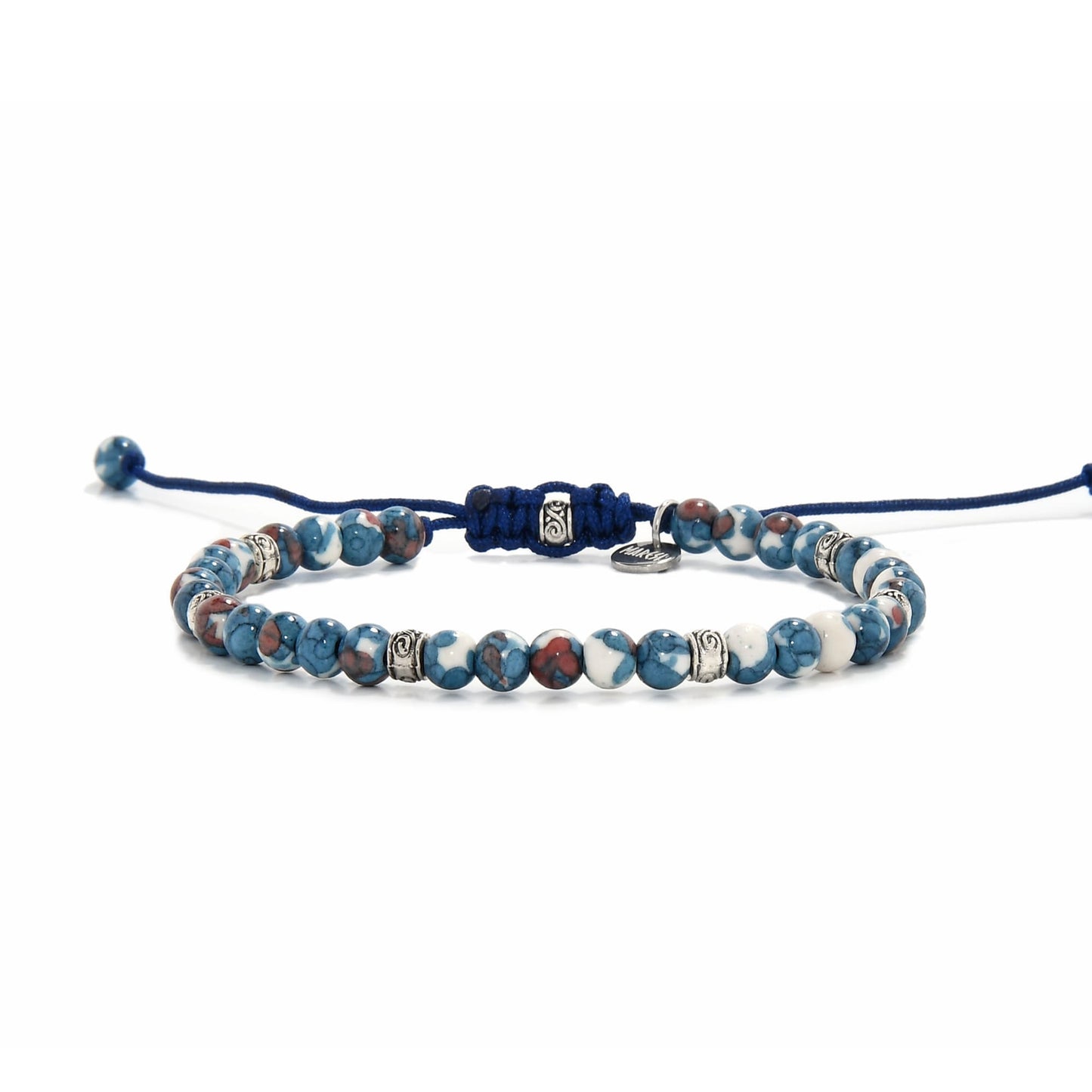 Close-up view of handcrafted blue jasper jewelry with silver accents