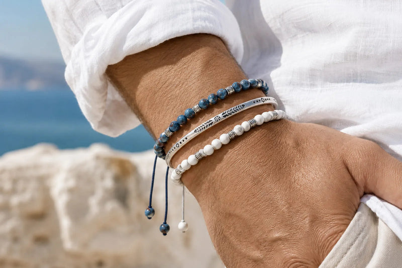 Blue, white and silver bracelet color combo worn as a three bracelet stack with white linen
