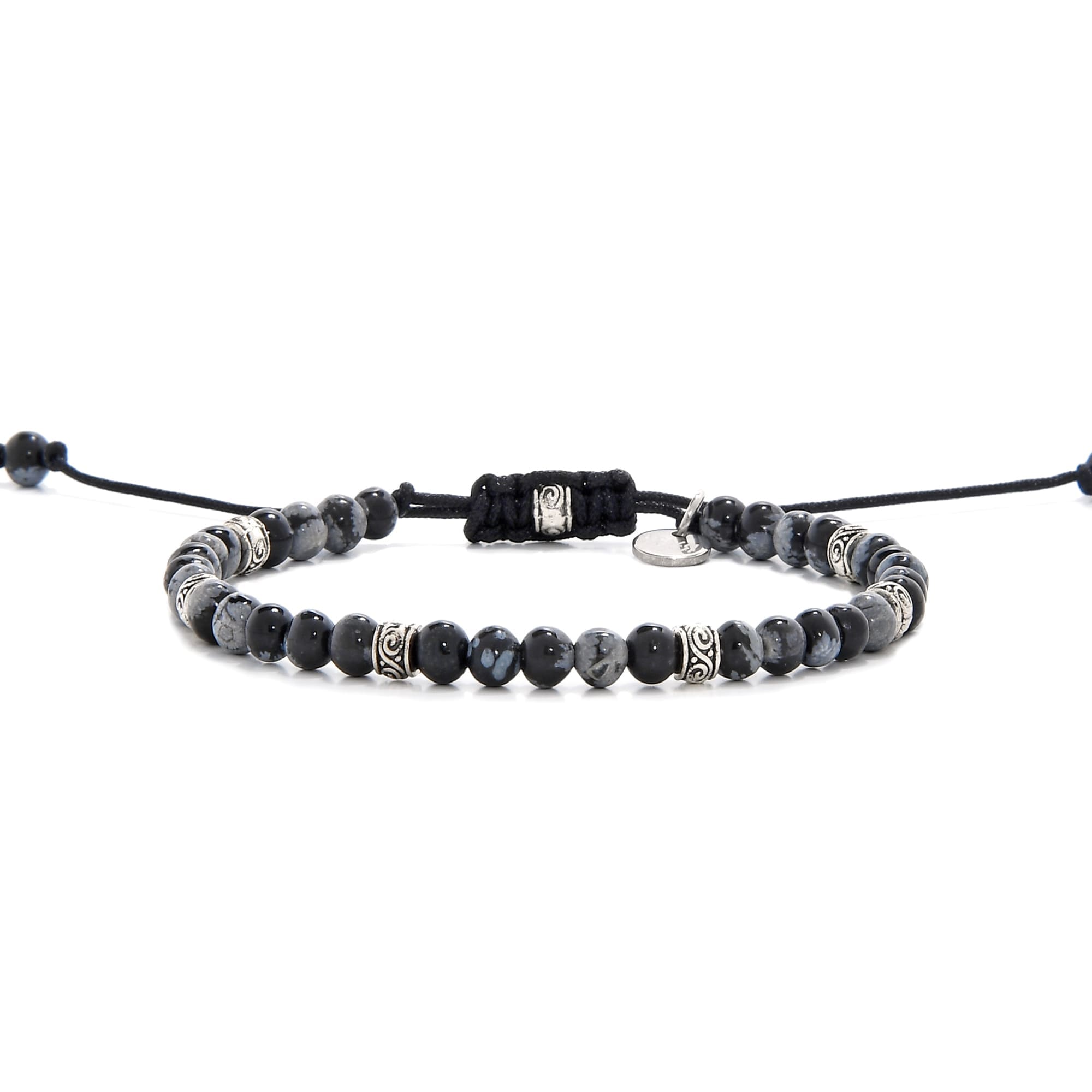 Full side view of the Bracelet Black Stone laid out flat with black cord and adjustable clasp.