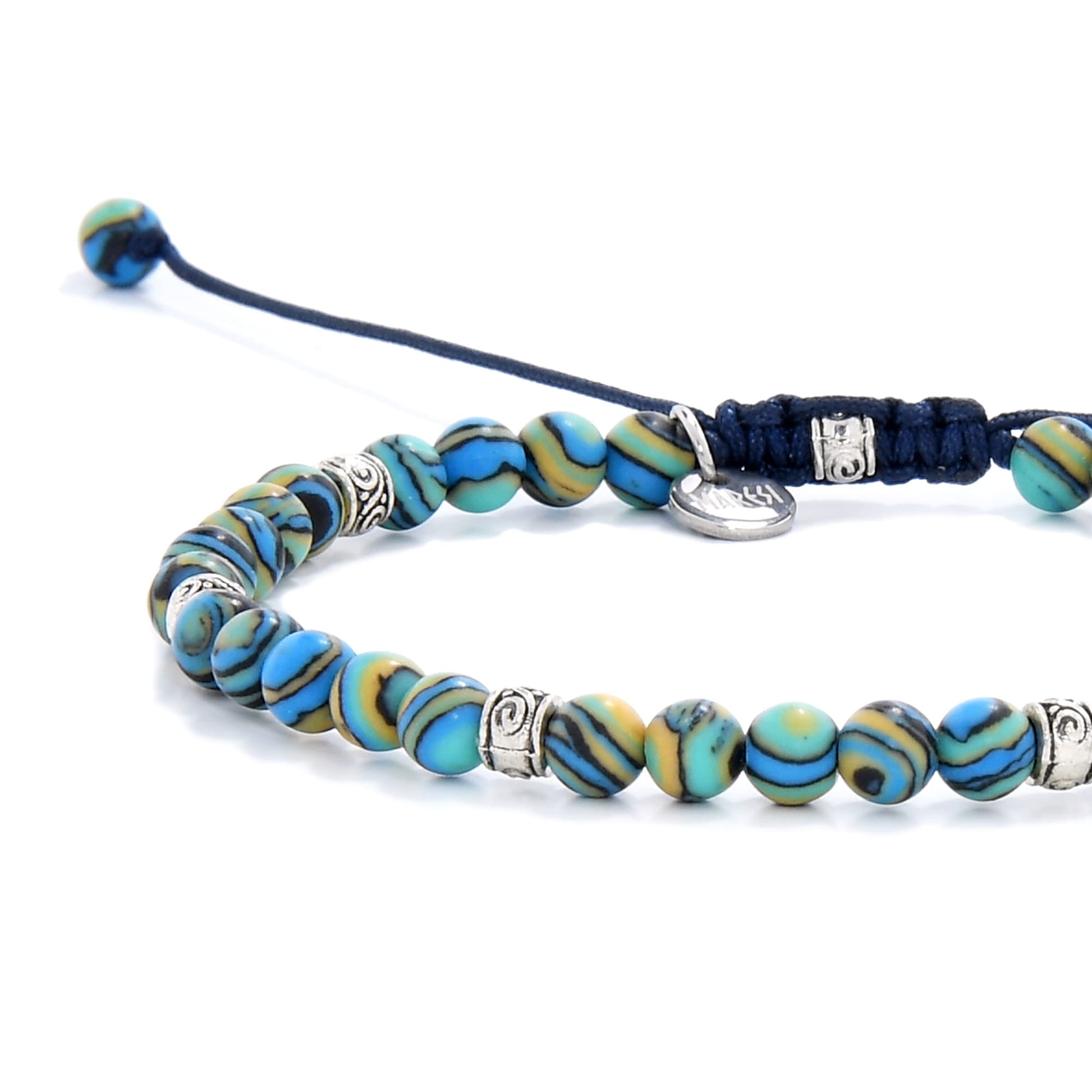 Bracelet malachite close-up showing blue, green, and gold striped beads with silver accents