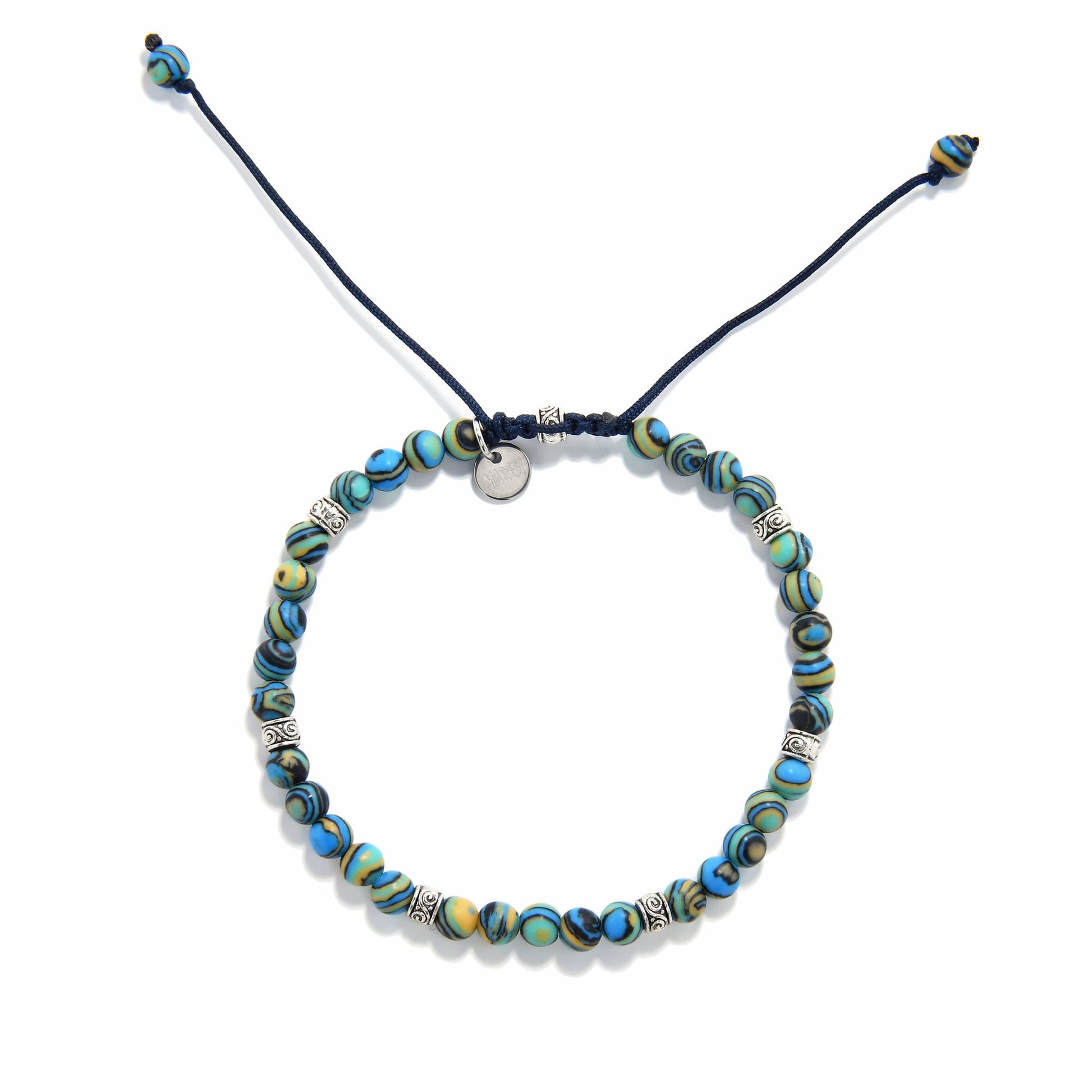 Bracelet malachite top view highlighting symmetrical beading and metal spacers on dark cord