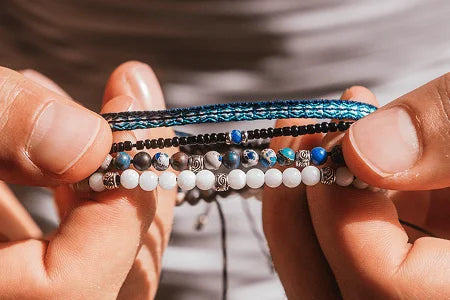 Glass bead bracelets showing hand strung construction with durable cord and seed beads