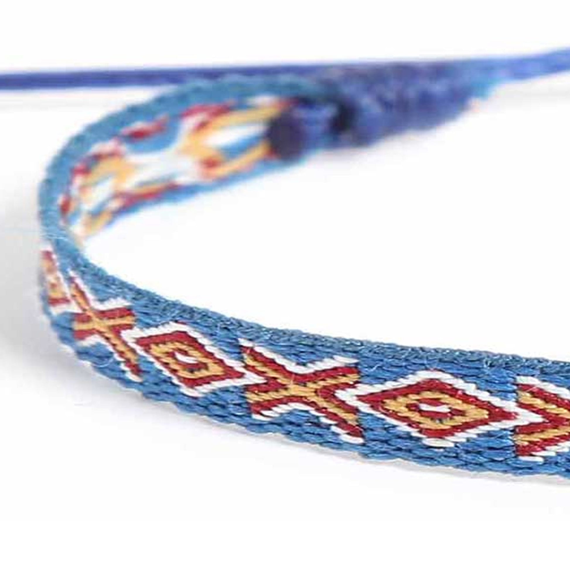 Blue braided bracelet with red and yellow geometric pattern close-up.