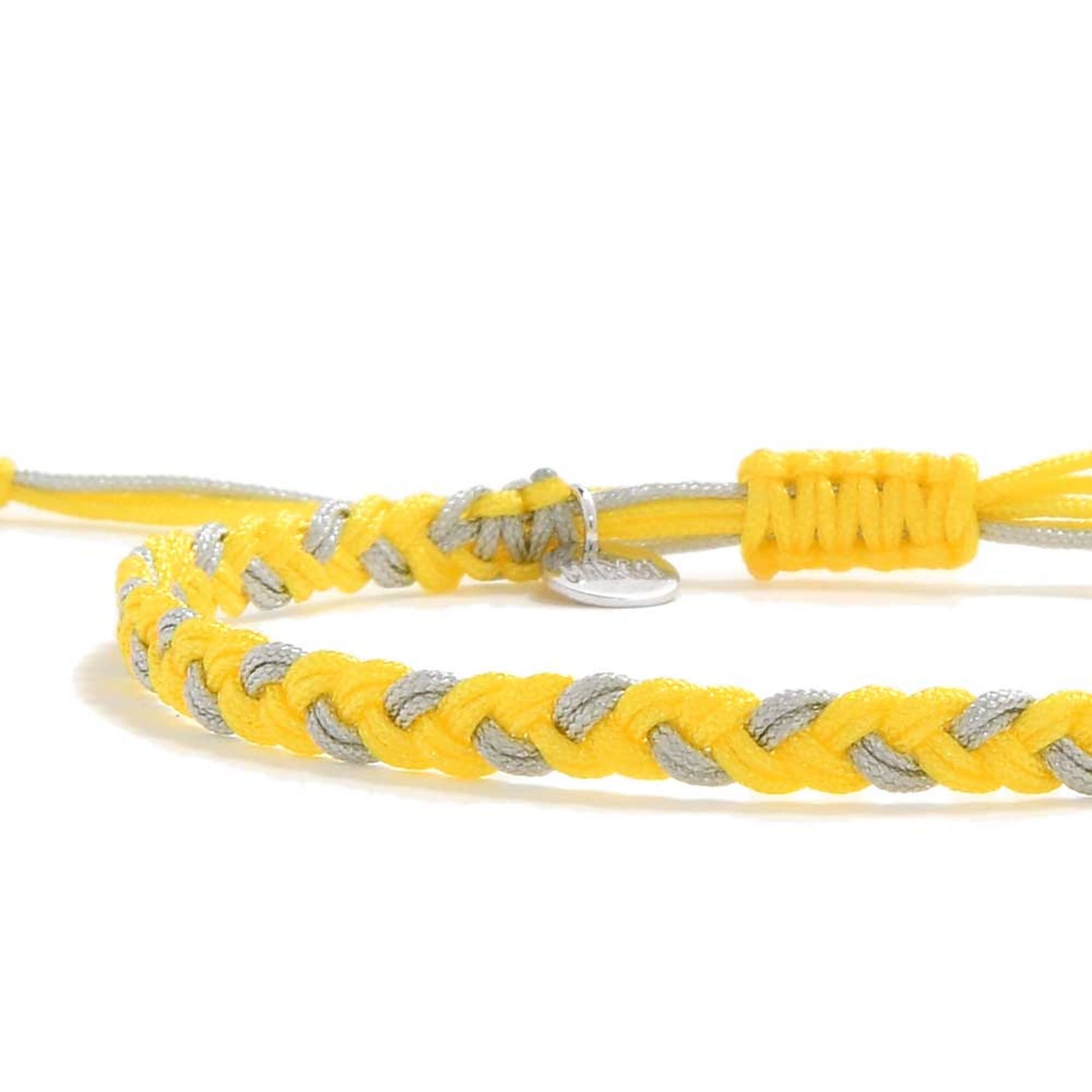 Handmade braided friendship bracelet thread in yellow and gray with macrame closure