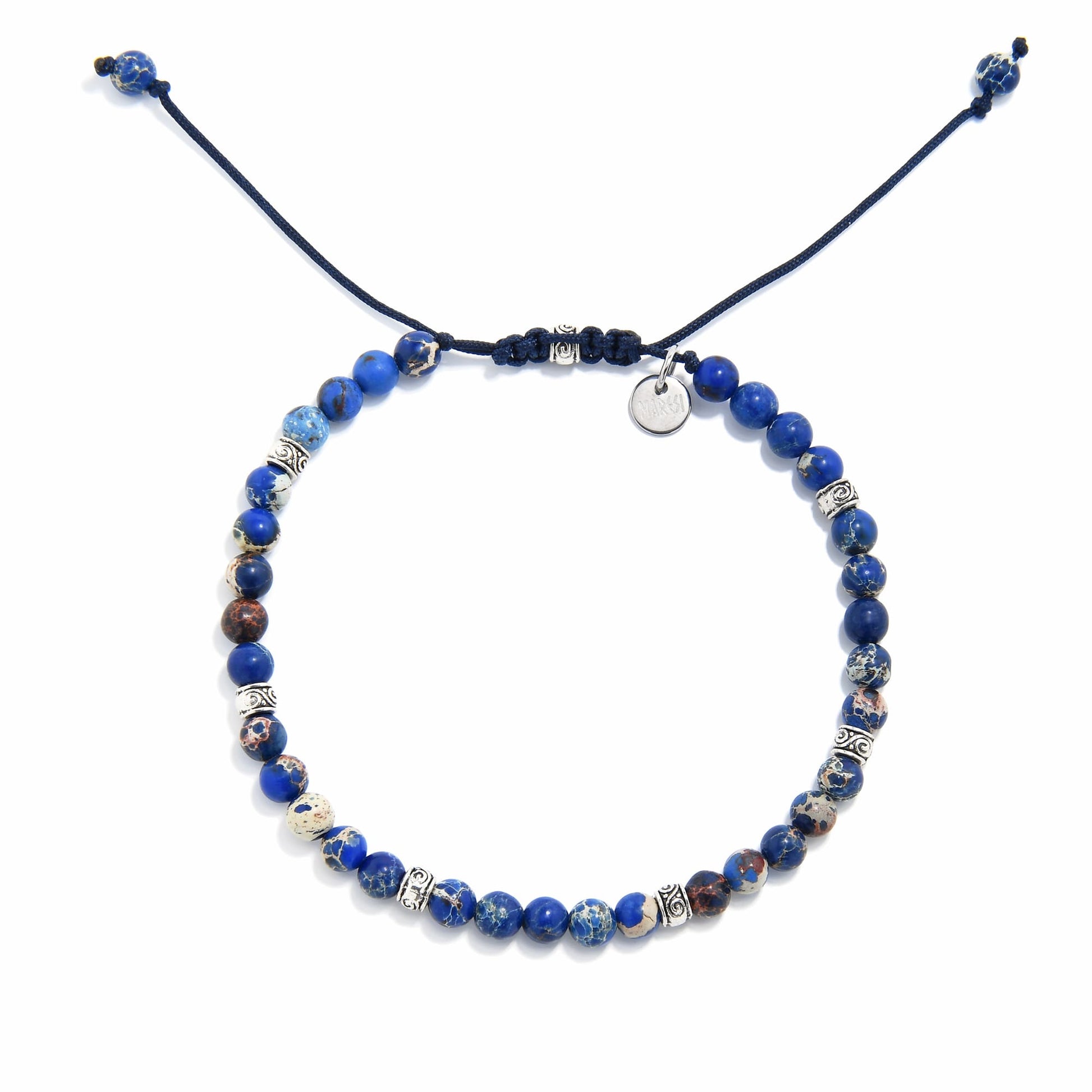 jasper stone bracelet featuring indigo sea sediment beads and silver accents on adjustable navy cord