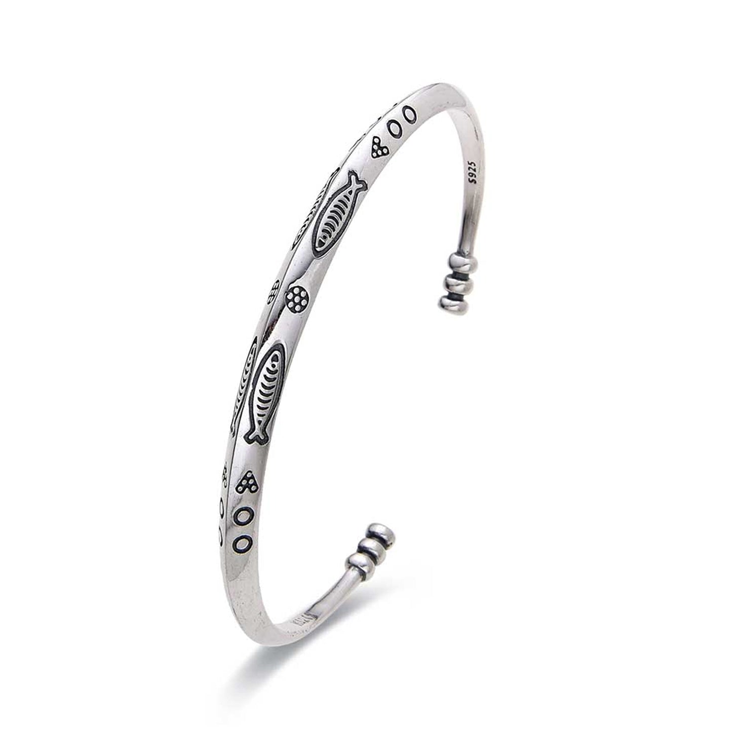 Elegant cuff bracelet with engraved ocean fish design
