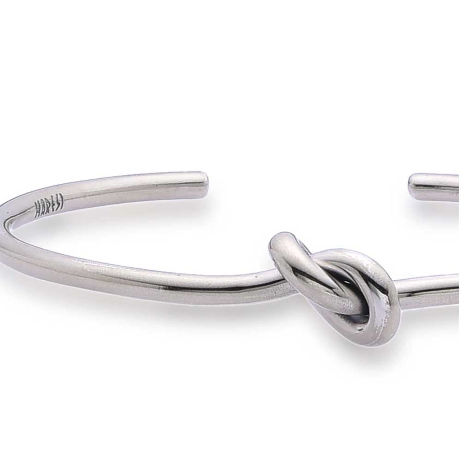 Close-up of knot detail on men silver bracelet.