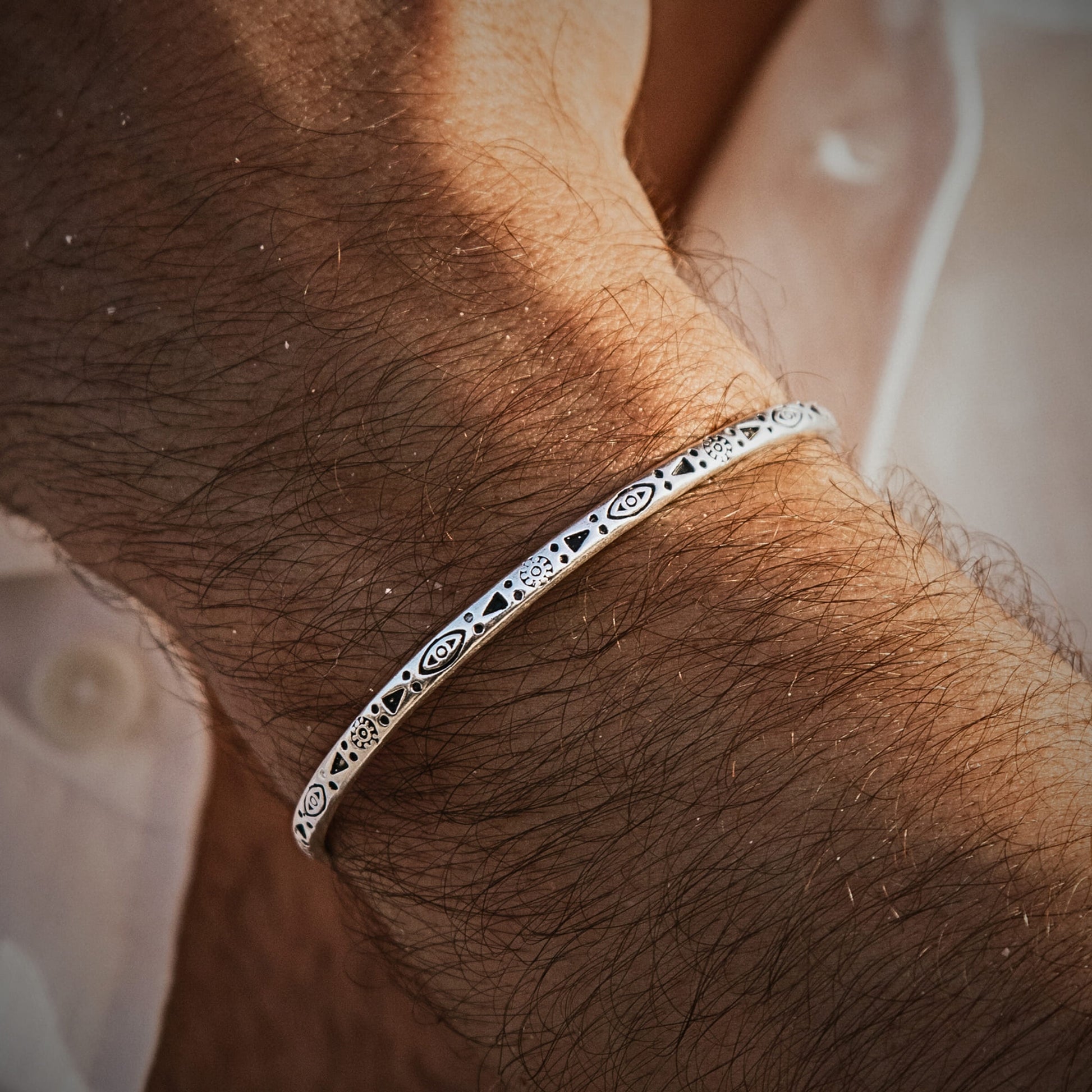 Elegant sterling silver mens bracelet with detailed engravings, perfect for everyday or evening style.