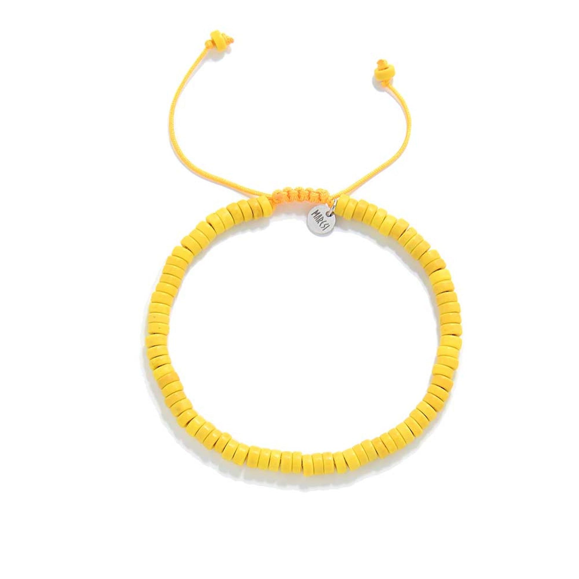 Overhead shot of adjustable yellow bracelet with round clay beads