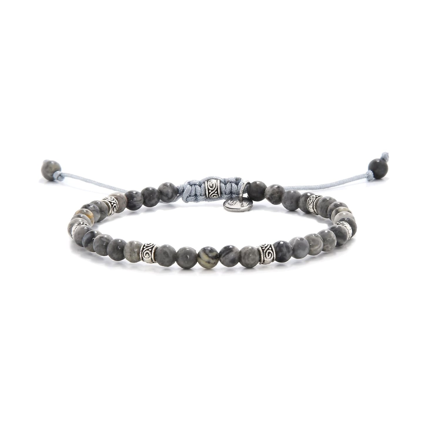 Beaded gray jasper bracelet with silver accent beads on adjustable cord.