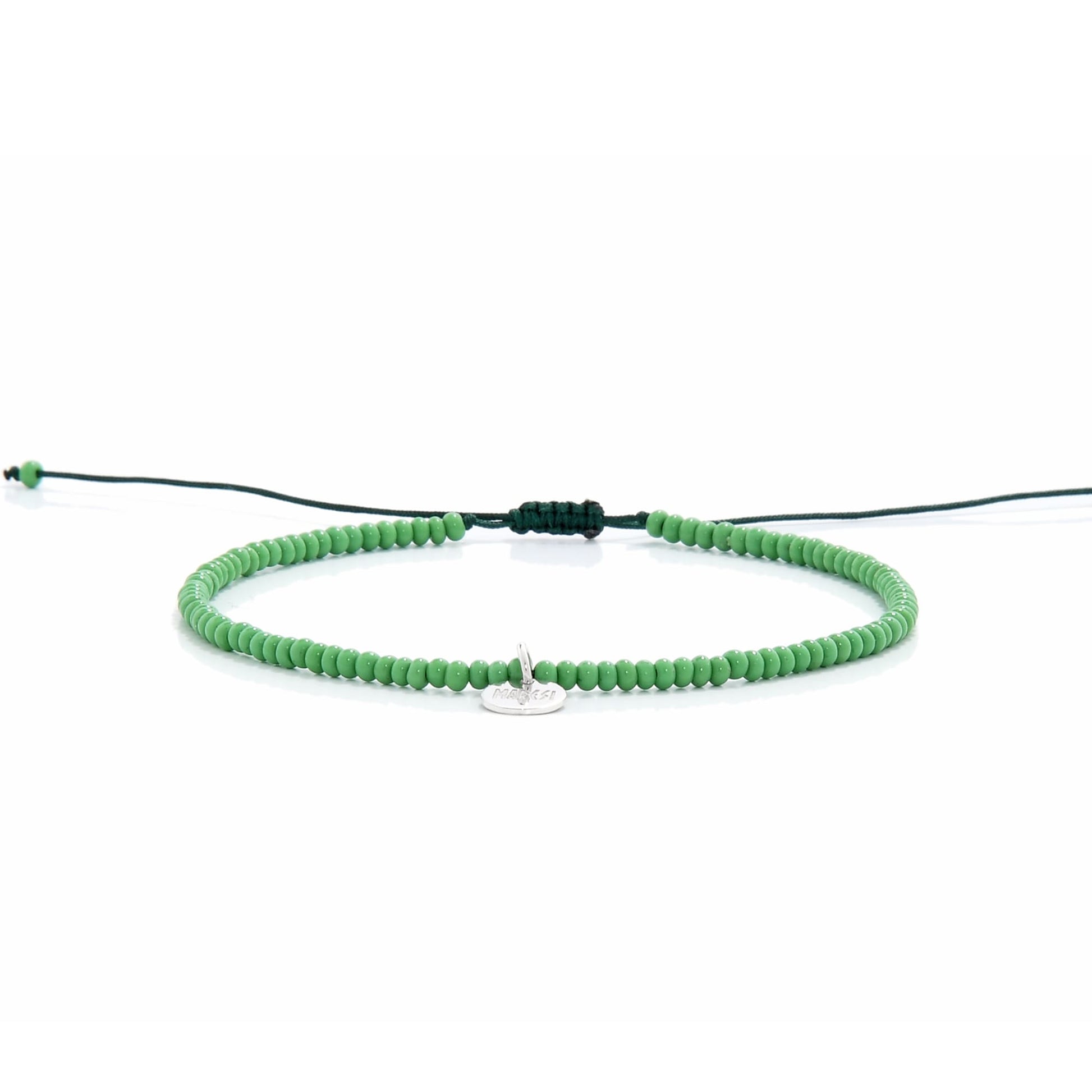 Minimalist green beaded stretch bracelet shown from side view