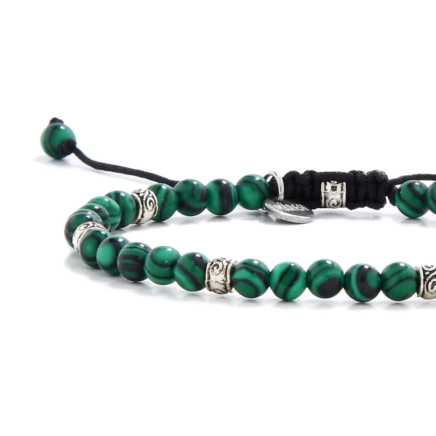 Malachite jewelry beads close-up showing bold green and black striping