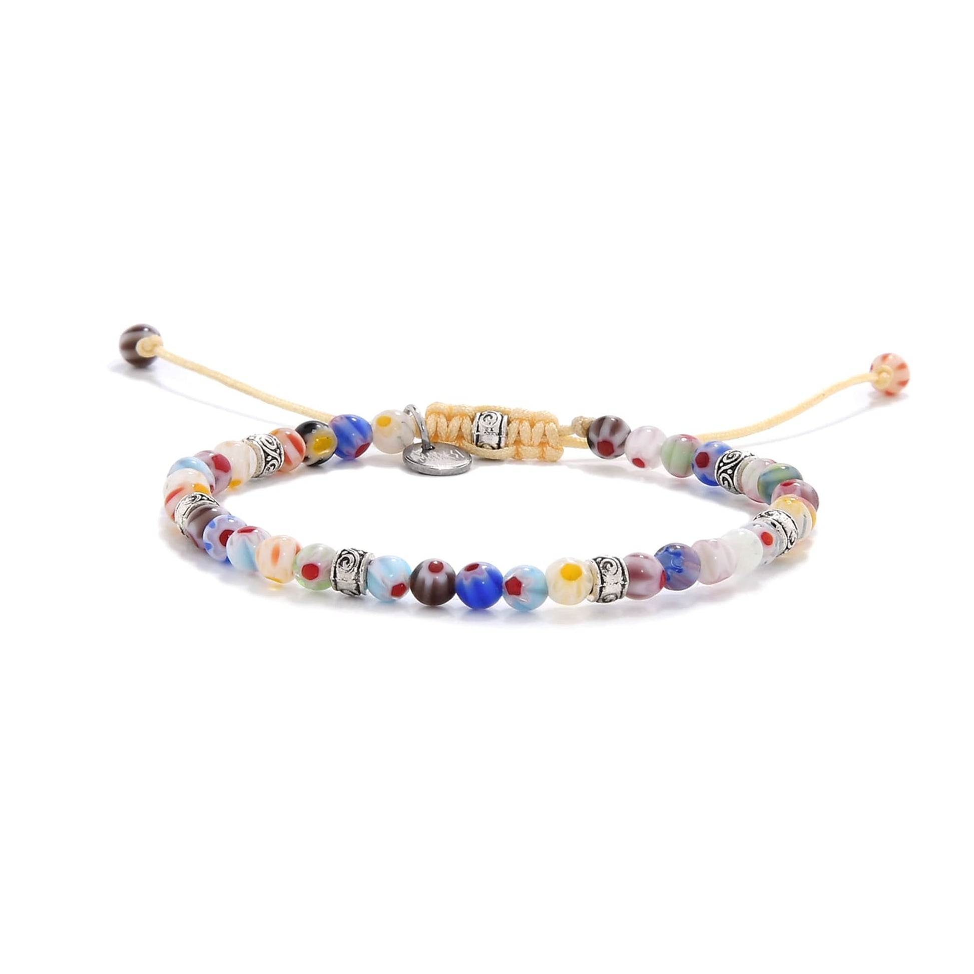 Handmade bracelet featuring colorful millefiori glass beads and decorative silver spacers.