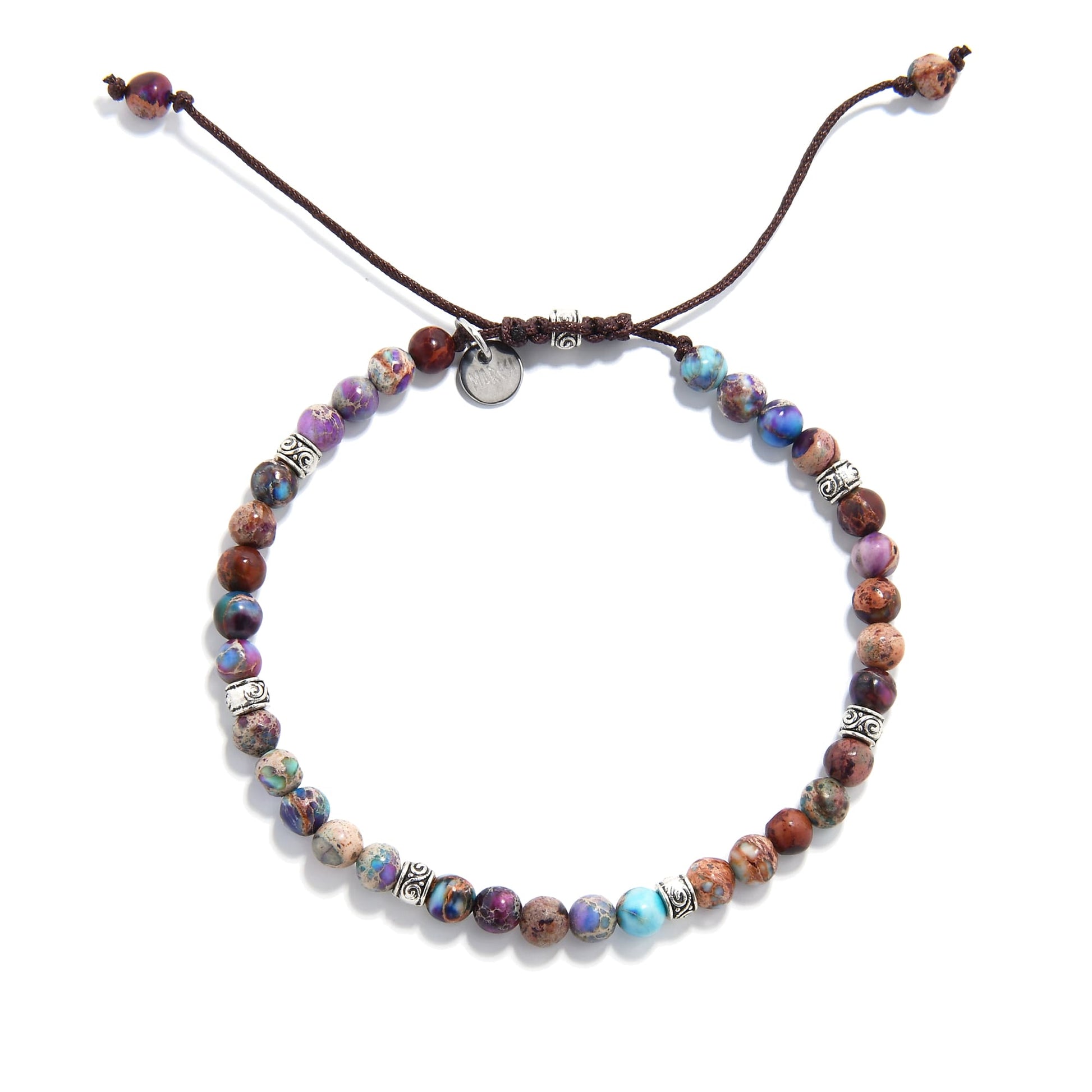 Top view of sea sediment jasper bracelet showing round beads in purple and blue tones
