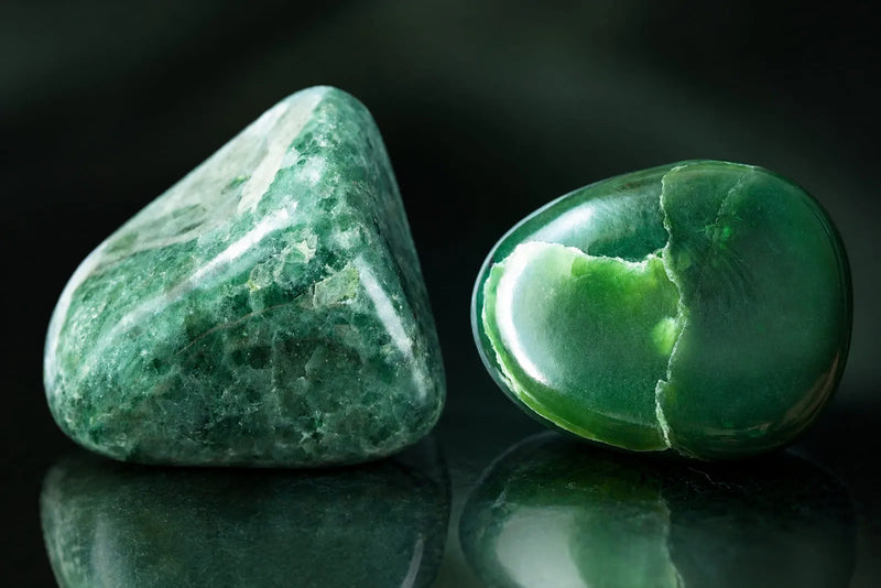 Jade Bracelet Beads material comparison showing polished jadeite and nephrite stones with distinct green tones and textures