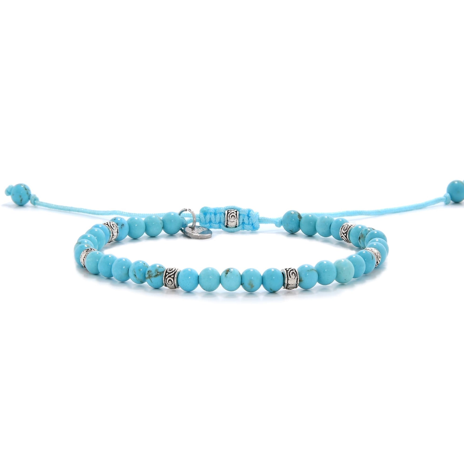 Handmade light blue turquoise bracelet with silver accents and adjustable cord.