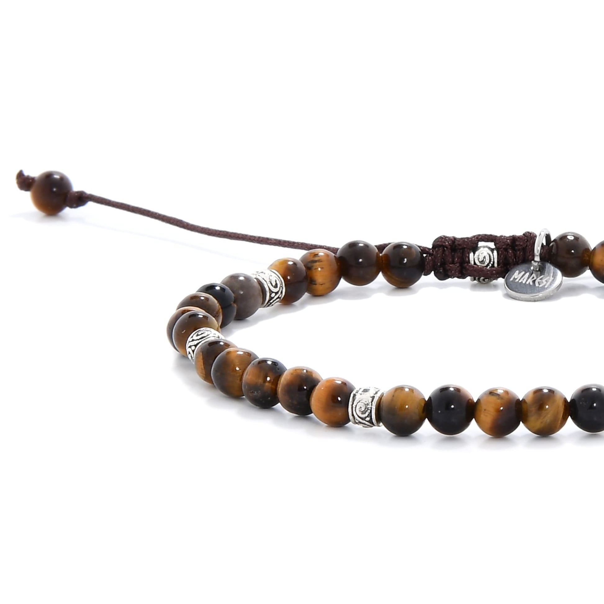 Close-up of a men's tiger eye bracelet with polished brown and black beads, featuring metal spacers and a brown adjustable cord.