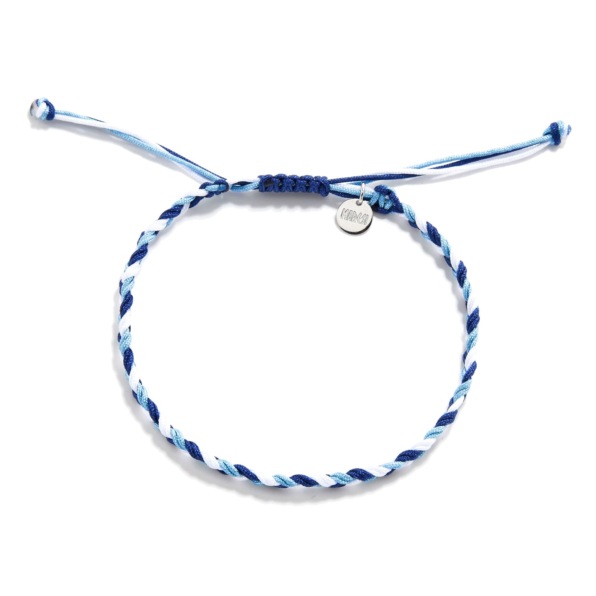 Flat lay of matching friendship bracelets in white, light blue, and navy with charm and knot