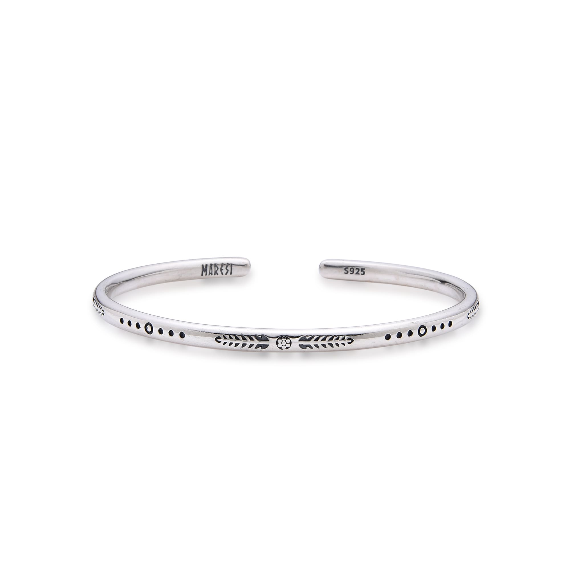 Slim silver bracelet bangle with engraved arrows and dots on plain background.