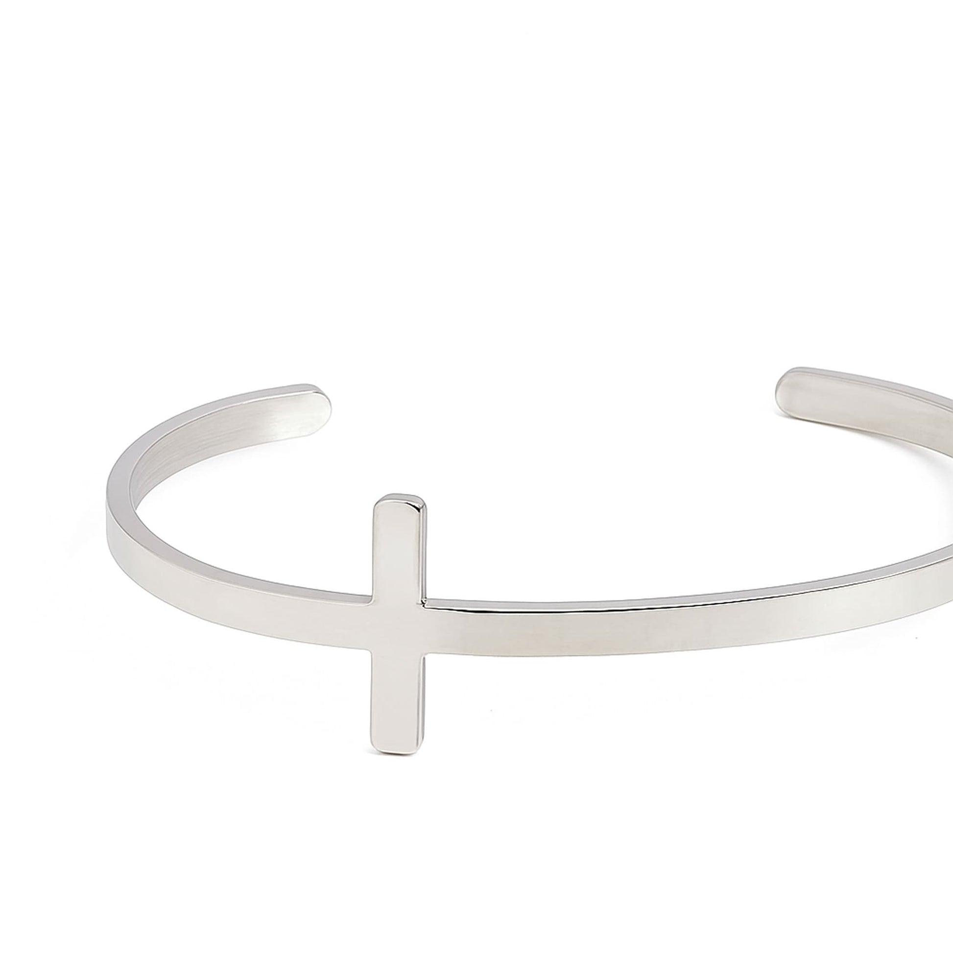 Sterling silver cross bracelet with polished, modern design.