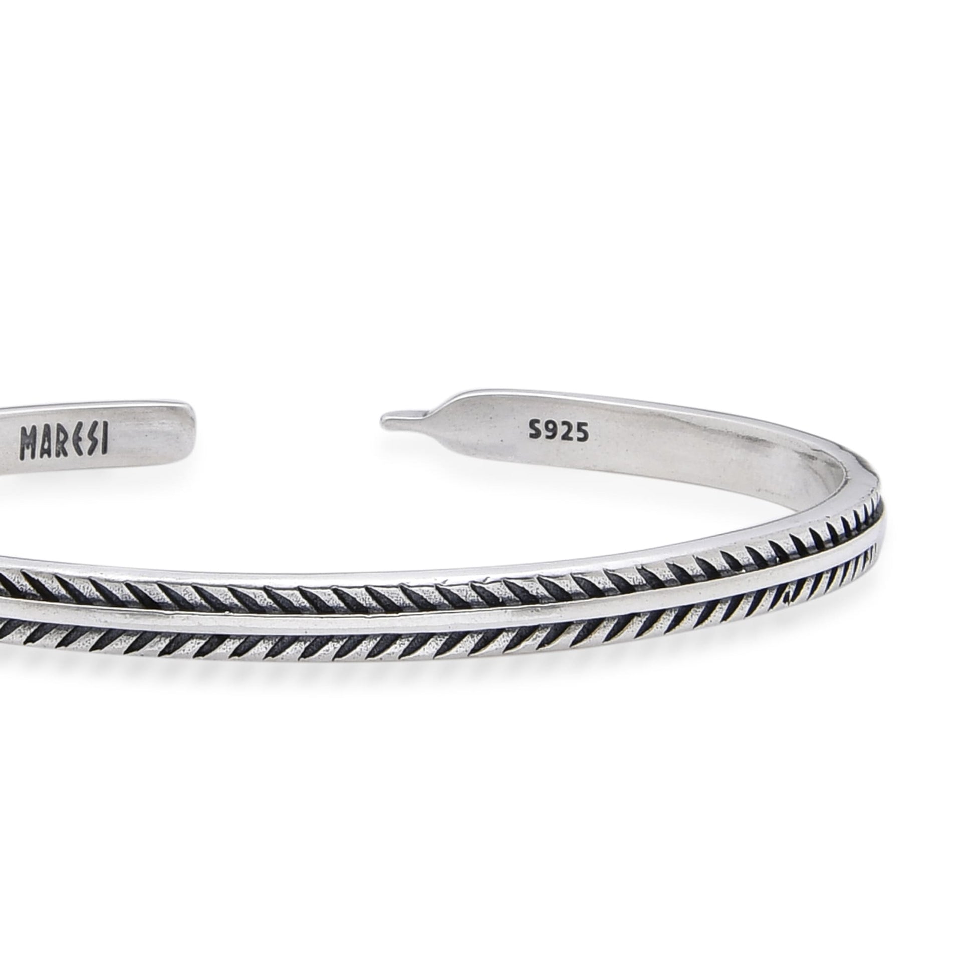 Detailed close-up of silver mens bracelet highlighting its textured design