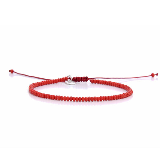A men beaded bracelet with small red beads and an adjustable cord, shot from a straight-on perspective on a white background.