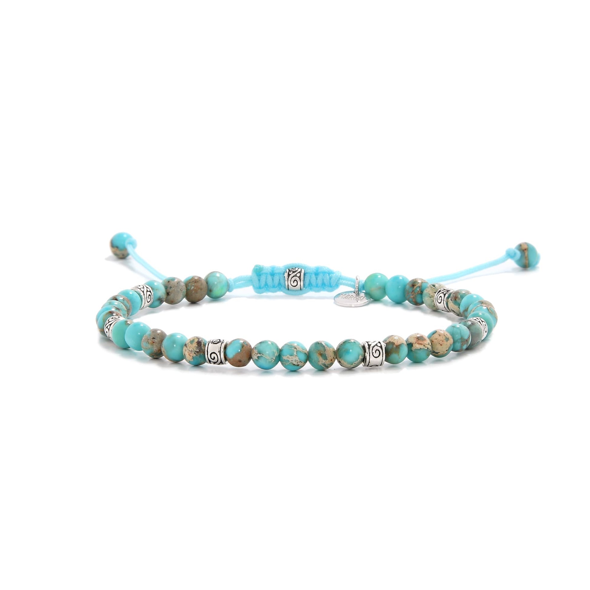 Turquoise jewelry bracelet with round beads and silver accent spacers.