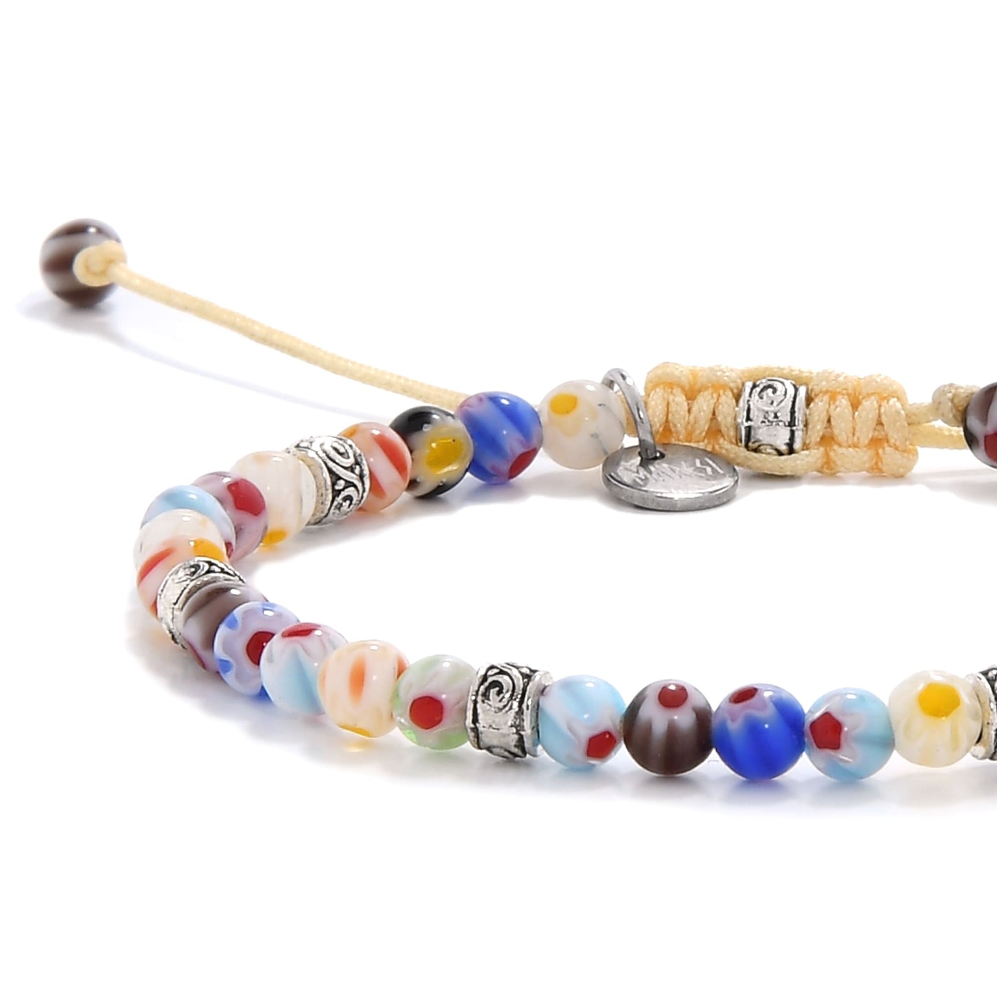 millefiori glass beads close-up highlighting individual patterns and silver accents