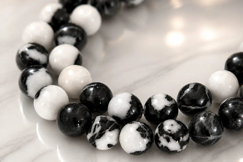 Close-up of a black-and-white patterned bead bracelet