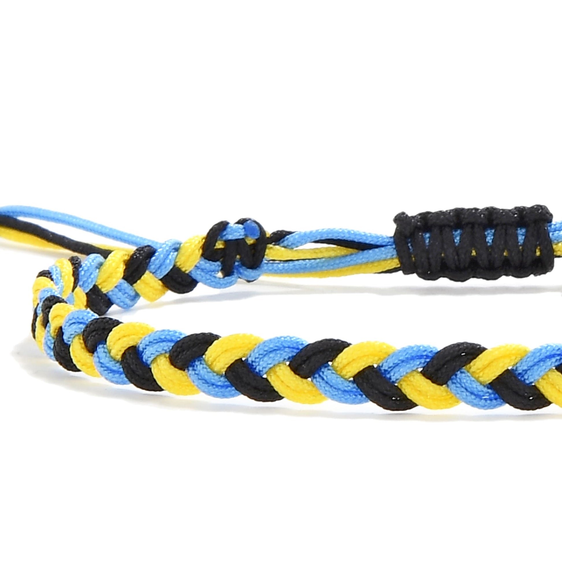 Close-up of zig zag friendship bracelet with braided yellow, black, and blue threads