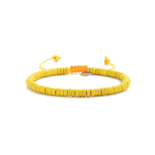 Handmade yellow bracelet with adjustable tie, laid flat on white background