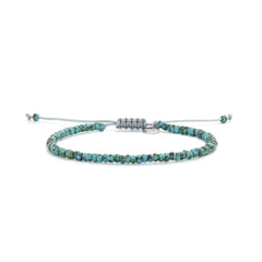 Bead Bracelet shown in full view with turquoise Picasso seed beads with gray cord and adjustable cord