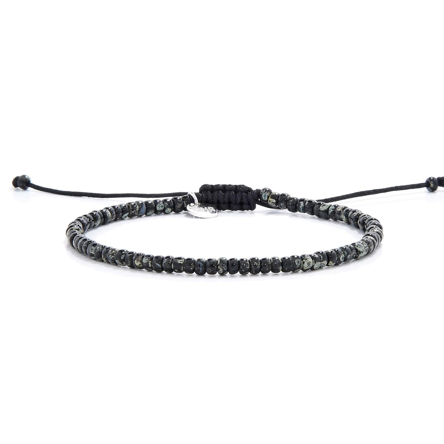 Front display of SCALA PICASSO seed bead bracelet with dark speckled seed beads on black string
