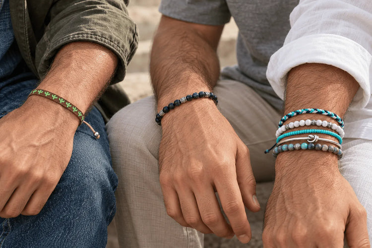 Three men wearing different bracelet styles, including woven, beaded, silver, and turquoise designs, showing some of the best bracelets for men.