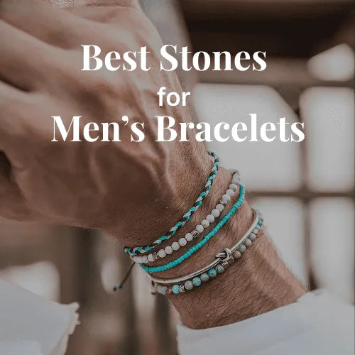 Stacked stone bracelets on a man’s wrist showing popular stones used in men’s bracelets