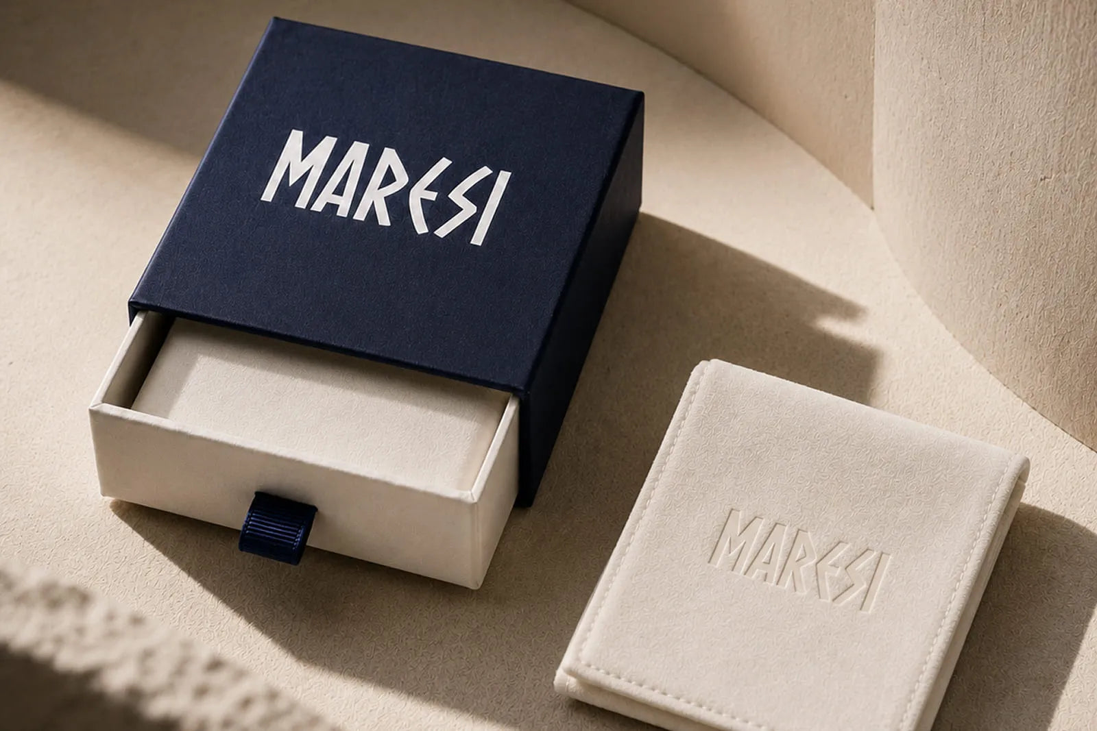 Bracelet gift for men presented in an elegant navy Maresi box with a soft cream jewelry pouch.