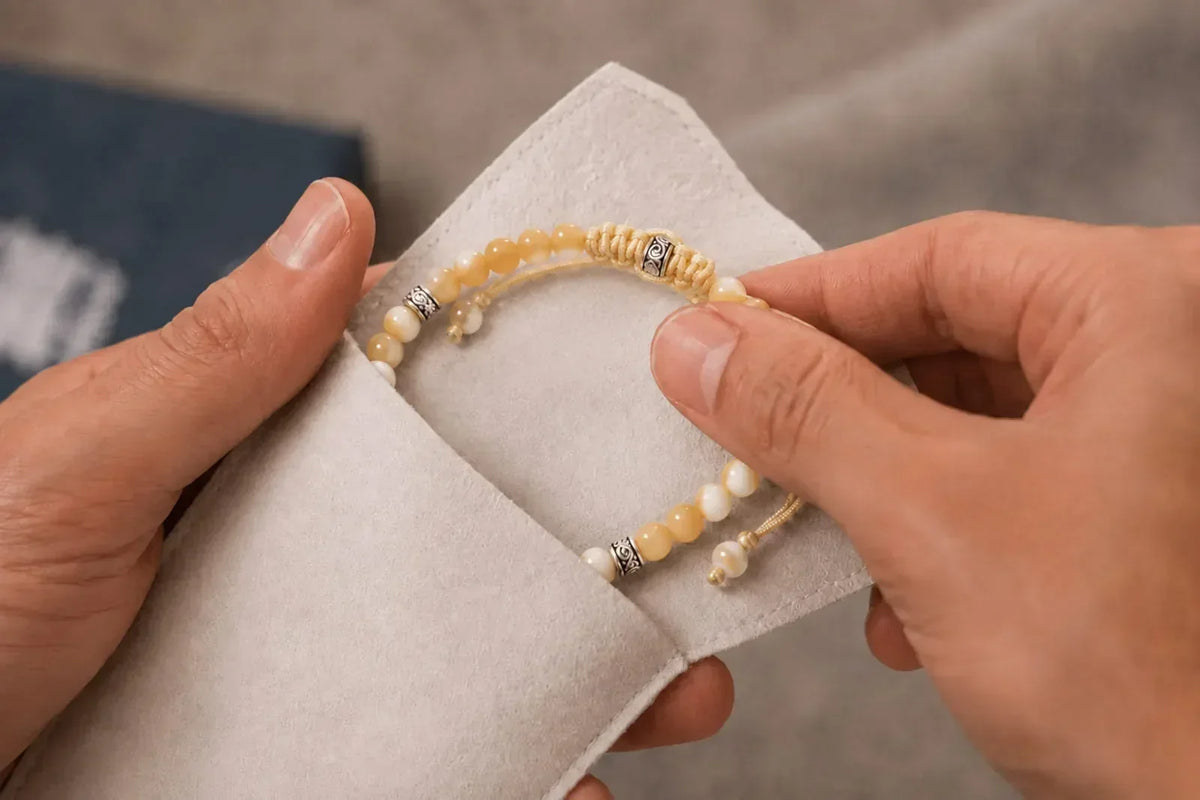 How to clean mother of pearl bracelet gently with a soft jewelry cloth while protecting the beads and silver details.