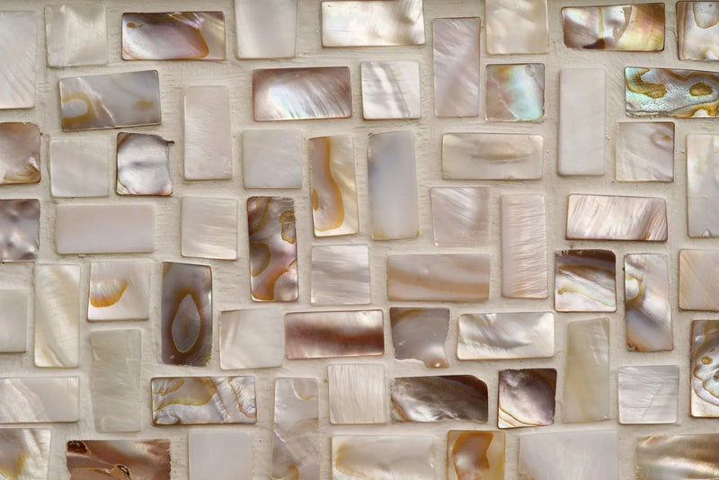Is Mother of Pearl Expensive? Rectangular mother of pearl pieces showing natural cream, silver, and iridescent tones.