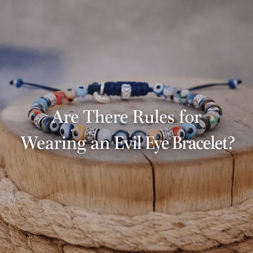 evil eye bracelet with natural stones on wooden surface