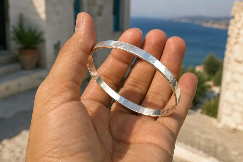 What Is a Bangle Bracelet? Silver bangle bracelet by the sea