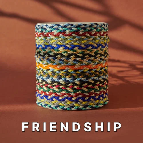 Friendship bracelets for sale stacked in a colorful woven pattern, showcasing a variety of vibrant, hand-braided cords on a neutral background.
