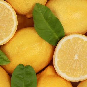 Close-up of lemons and green leaves, symbolizing yellow bracelets