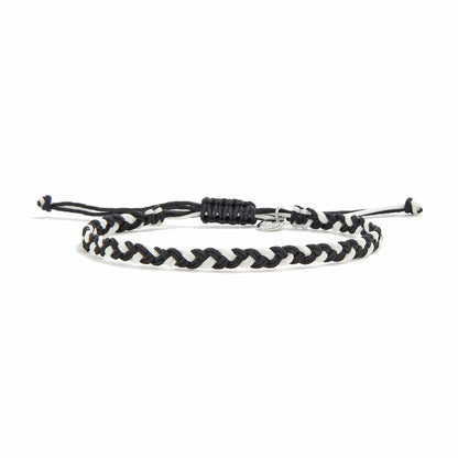 Friendship woven bracelet featuring a black and white twisted cord, displayed on a white background.