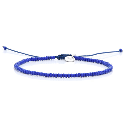 Elegant blue stretch bead bracelet with silver tag